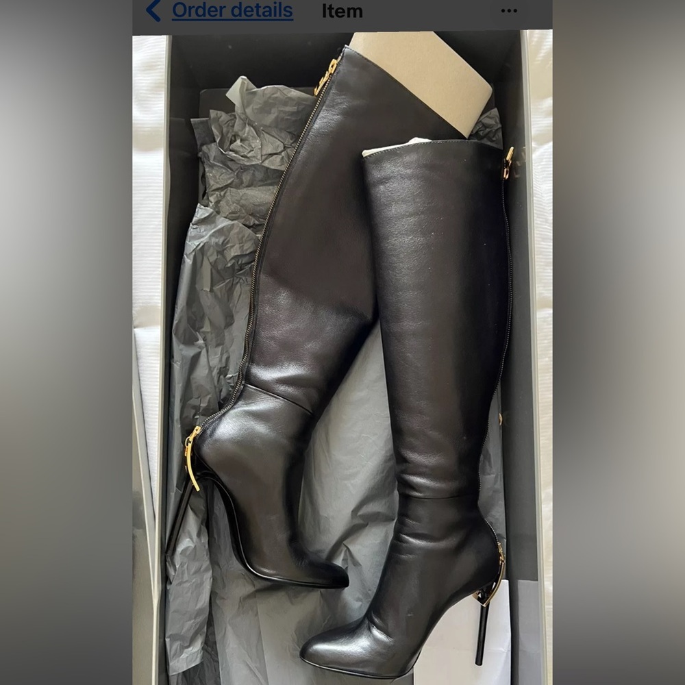 Black tall/high black leather boots gold zipper with a beautiful formal look.